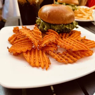 Really good build your own burger with generous toppings included, with sweet potato waffle fries.