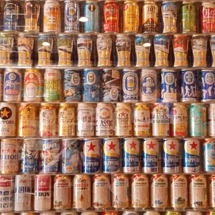 a wall of beer cans