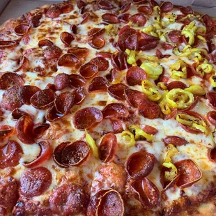 Large pepperoni w extra sauce, banana peppers on half