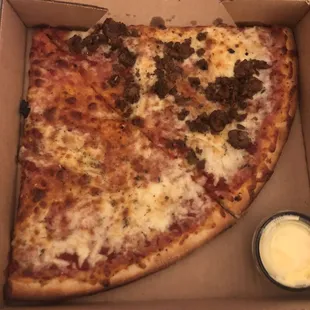 Cheese and Uncle Frank's Spicy Sausage slices.  I think this was $10.  Prices are UP