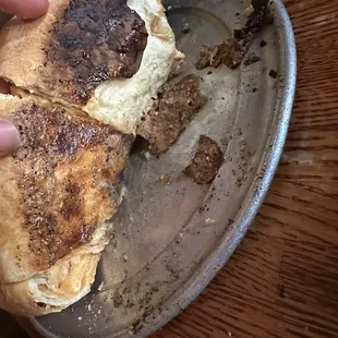 Burnt and soggy pizza