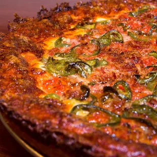 Pan Style "Rance's Favorite" with meatballs, bacon and jalapeno featuring our signature caramelized crust.