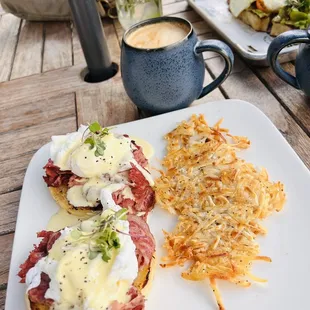 a plate of food and a cup of coffee