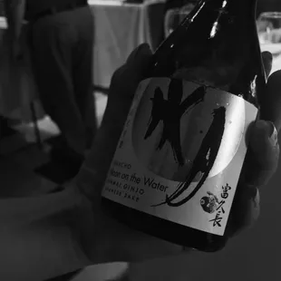 a person holding a bottle