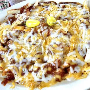 Small chili-cheese fries is actually rather large. Tabasco sauce &amp; yellow chiles on side, so nice.