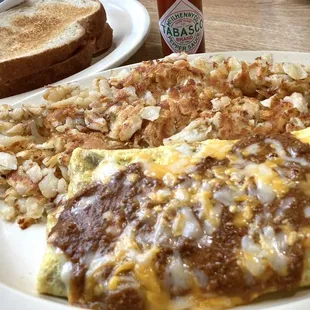 Chili-cheese omelette, hashbrowns &amp;Tabasco, w/ toast &amp; jam. Yum, Saturday night breakfast..