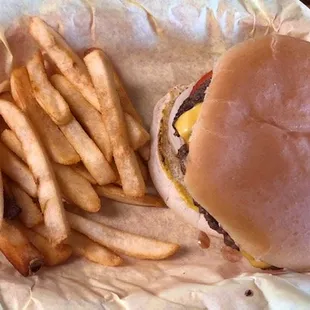 A fantastic cheese burger and 1/2 order of fries