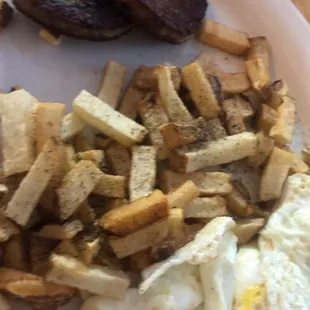 2 eggs over easy home fries and sausage patty