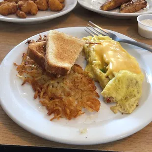 Veggie cheese omelet, hash browns, sausage and cheese omelet, fried cauliflower and 1 slice of French toast