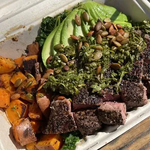 Bowl with steak, sweet potatoes, kale, avocado