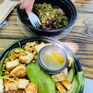 a person eating a salad with a fork