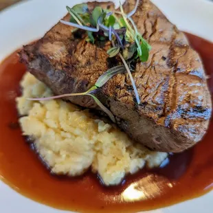 a steak and mashed potatoes