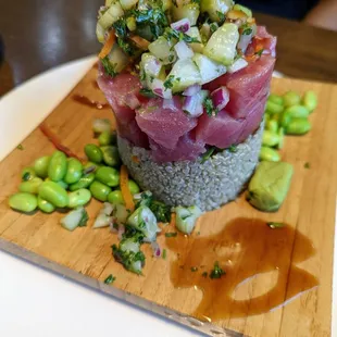 a tuna salad on a bed of rice
