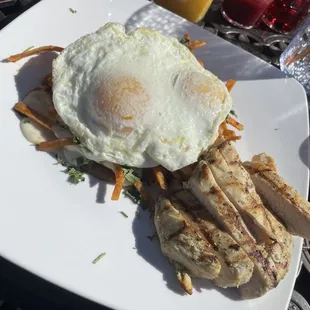 Chilaquiles with over easy egg and chicken