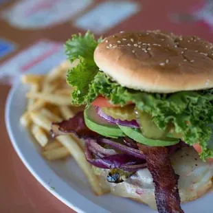 a burger and fries on a plate