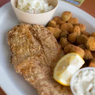 a plate of fried fish and tater tots