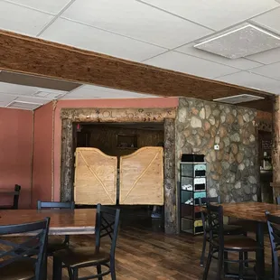 tables and chairs in a rustic setting
