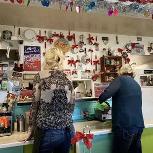 a woman and a man at the counter