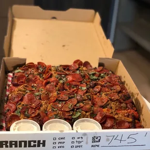 Wonderful Detroit-style rectangular pepperoni pizza, with obviously, plenty of pepperoni and extra side of ranch dressing.