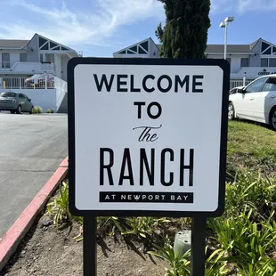 a welcome sign for the ranch at newport bay