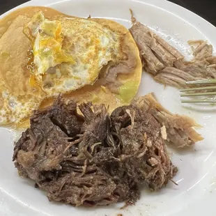 Barbacoa and egg and bean tostada