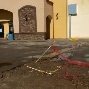 a broken shopping cart on the ground