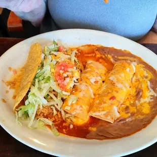 Soggy taco and 2 enchilada lunch with beans and rice.