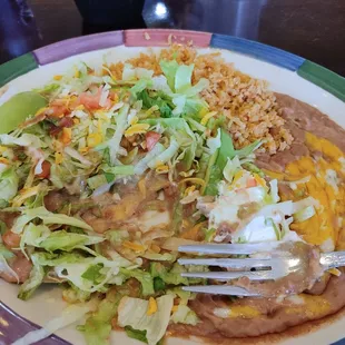 Soggy tostada with beans and rice.