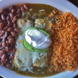 Spinach Enchiladas with Rancho Beans and Rice. (Yum!) The green tomatillo enchilada sauce they use on this is amazing!