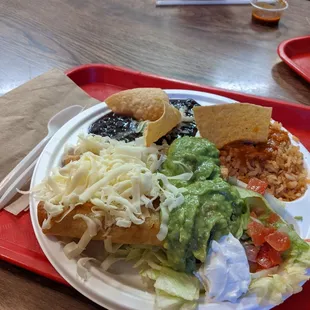 4 taquitos with pinto beans and rice.