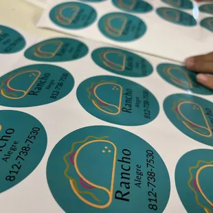 a person placing a sticker on a table