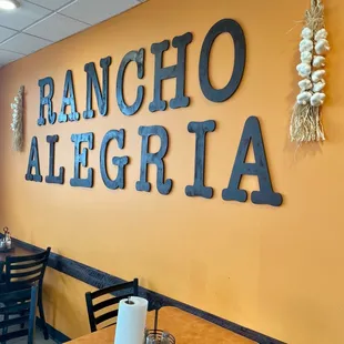 Restaurant name on wall inside