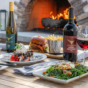 Beautiful outdoor dining with roaring fireplace
