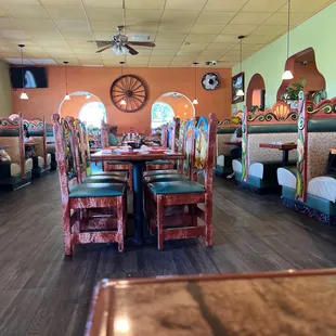 a woman sitting at a table in a mexican restaurant