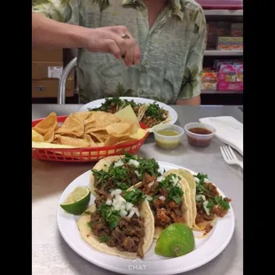 a plate of tacos and chips