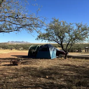Subaru with hatchback tent and side lean to.