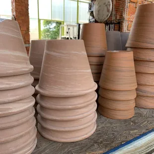 Terra cotta pots with a twist.  We love the new swirl design.