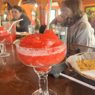 a frozen drink with a straw in a glass