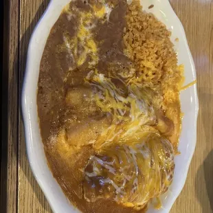 Enchilada, tamale, rice and beans.