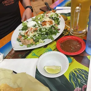 a plate of food and a glass of beer