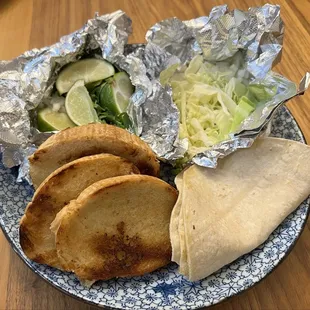 Posole and menudo came with cilantro, onions, limes, and cabbage and a choice of either tortillas, bread, or tostadas.