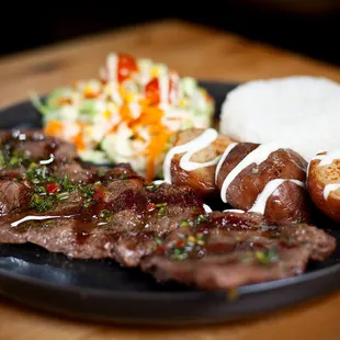 a plate of steak and potatoes