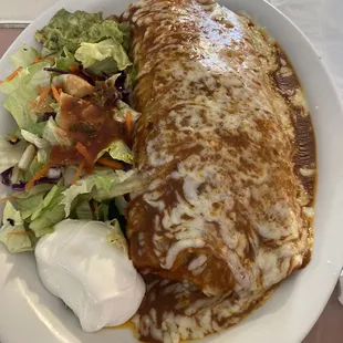 Super carnitas burrito with red sauce