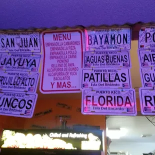 menus hanging from the ceiling of a restaurant