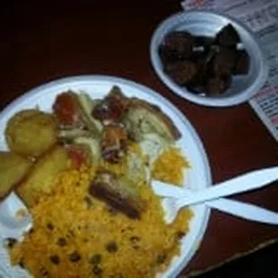 Arroz con Gandules ,Lechon asado ,rotisserie Pig with yellow rice and beans  oh and Morsillas  Puertorican Food  come and visit