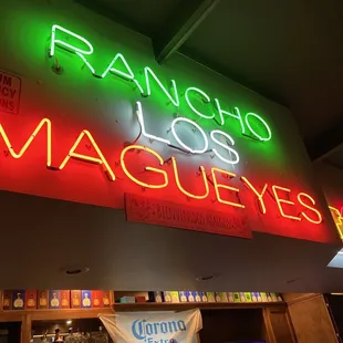 a neon sign for a restaurant