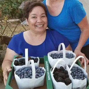 Very happy with their harvest.