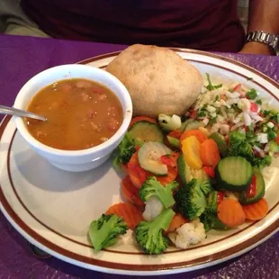 Fried, stuffed avocado with a side of vegetables