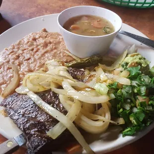 Carne Asada with refried beans and anothertype of beans, which was well seasoned.