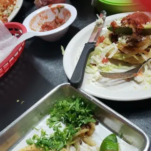 Tacos de barbacoa and one sope el pastor